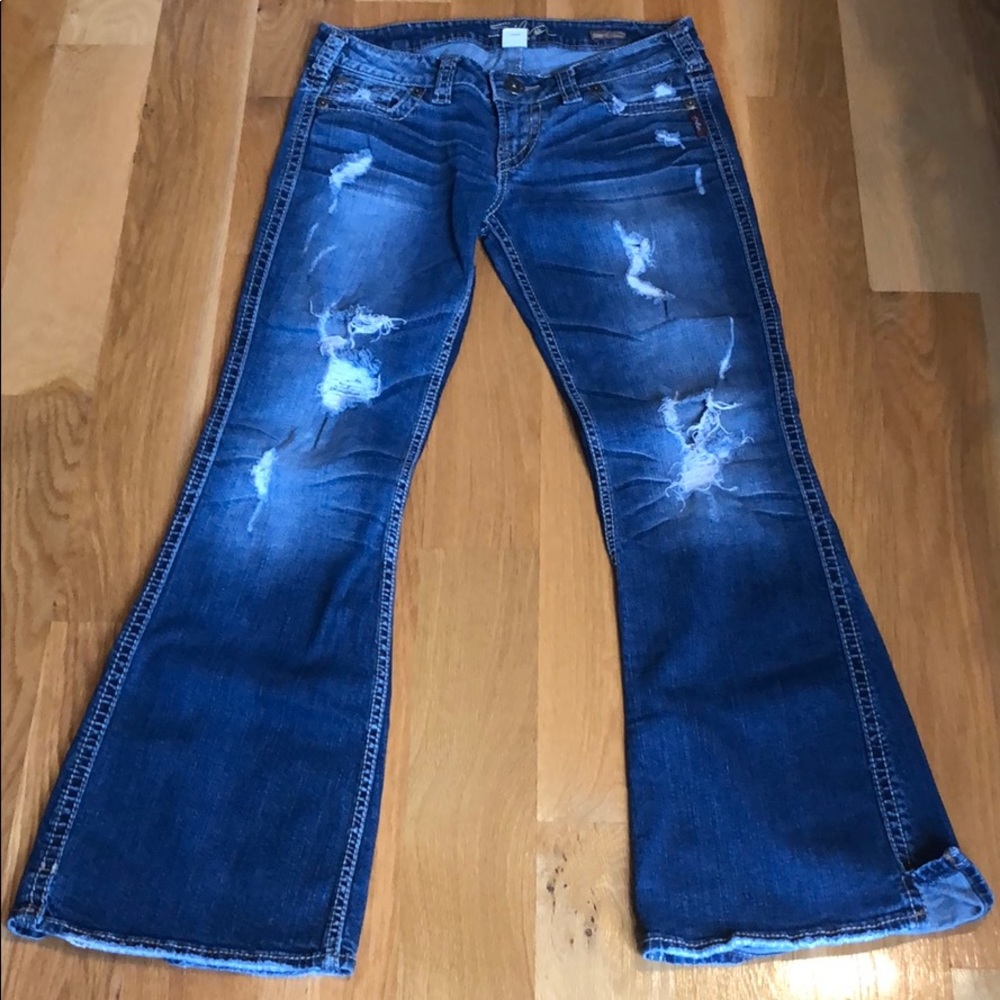 Silver distressed flare jeans